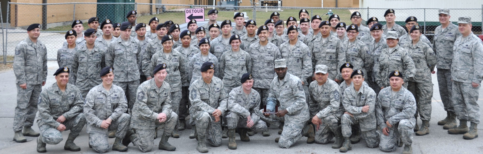 Airmen from the 433rd Security Forces Squadron, Joint Base San Antonio-Lackland, Texas, pose with Col. Aaron Vangelisti, 433rd Airlift Wing commander, (far right) and 433rd Mission Support Group Commander Col. Craig Petersen, March 8, 2014. The SFS won Air Force Reserve Command’s 2013 Outstanding Security Forces Tenant Unit of the Year.  (U.S. Air Force by Tech Sgt. Carlos J. Trevino)