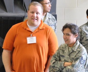 Steve Veselka, a manager at Canine Country Club in Katy, Texas chats with his employee, Staff Sgt. Jennifer Martinez prior to lunch during 433rd Airlift Wing's Employer Orientation Day, March 8 at the Cargo Loading Training Facility. Civilian employers got a first-hand look what their employees do when they put on the military uniform on a Unit Training Assembly weekend. (U.S. Photo by Tech Sgt. Carlos Trevino)
