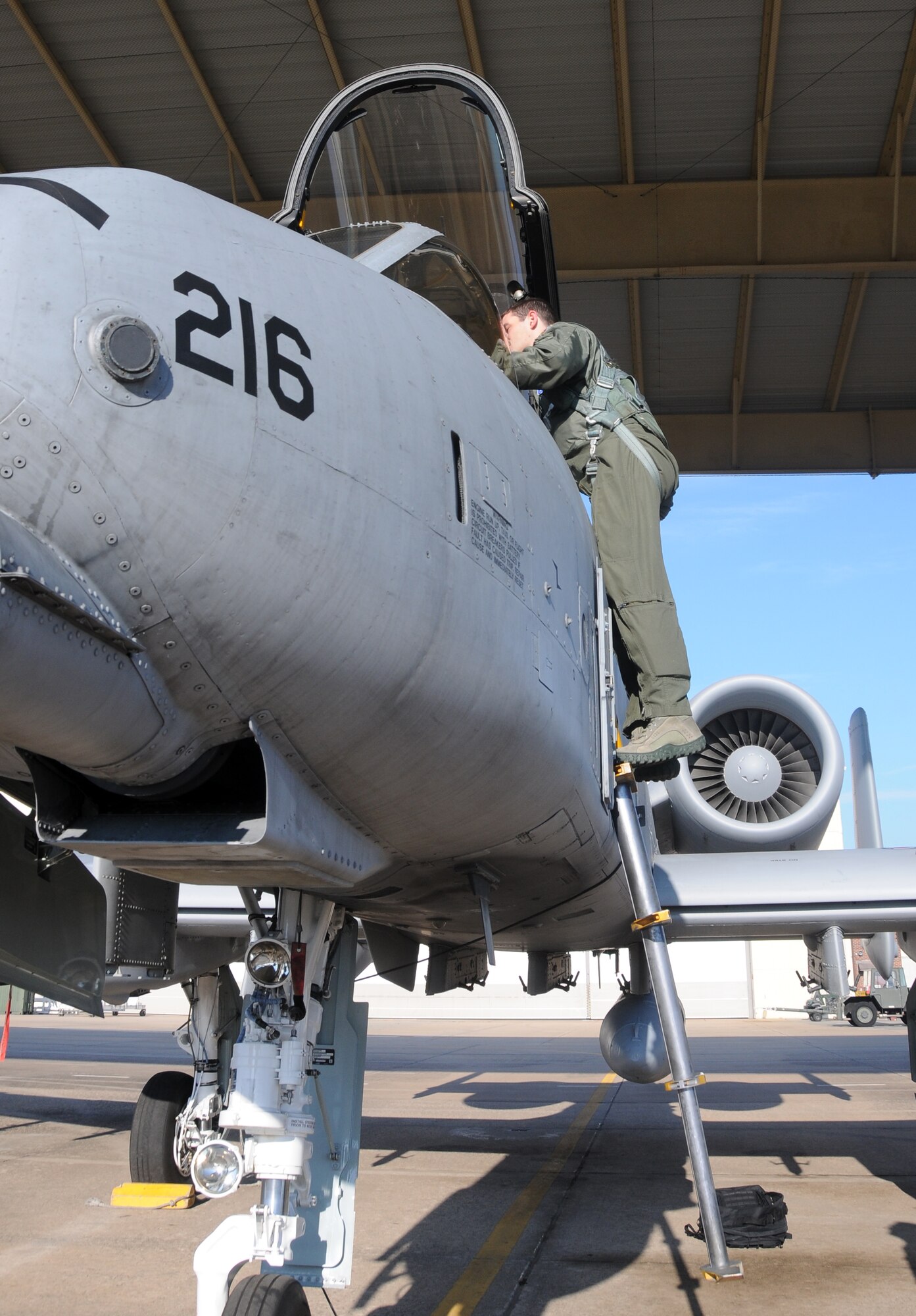 1st Lt. Ellis Moser, a 74th Fighter Squadron pilot, climbs into the cockpit of an A-10C Thunderbolt II "Warthog" March 6, 2014, at Ebbing Air National Guard Base, Fort Smith, Ark., March 6, 2014, Moser delivered the aircraft to Moody Air Force Base, Ga., as part of the 188th Fighter Wing's mission conversion from A-10s to a remotely piloted aircraft, intelligence and targeting mission. The 188th has six remaining A-10s on station. (U.S. Air National Guard photo by Senior Airman John Hillier/released)