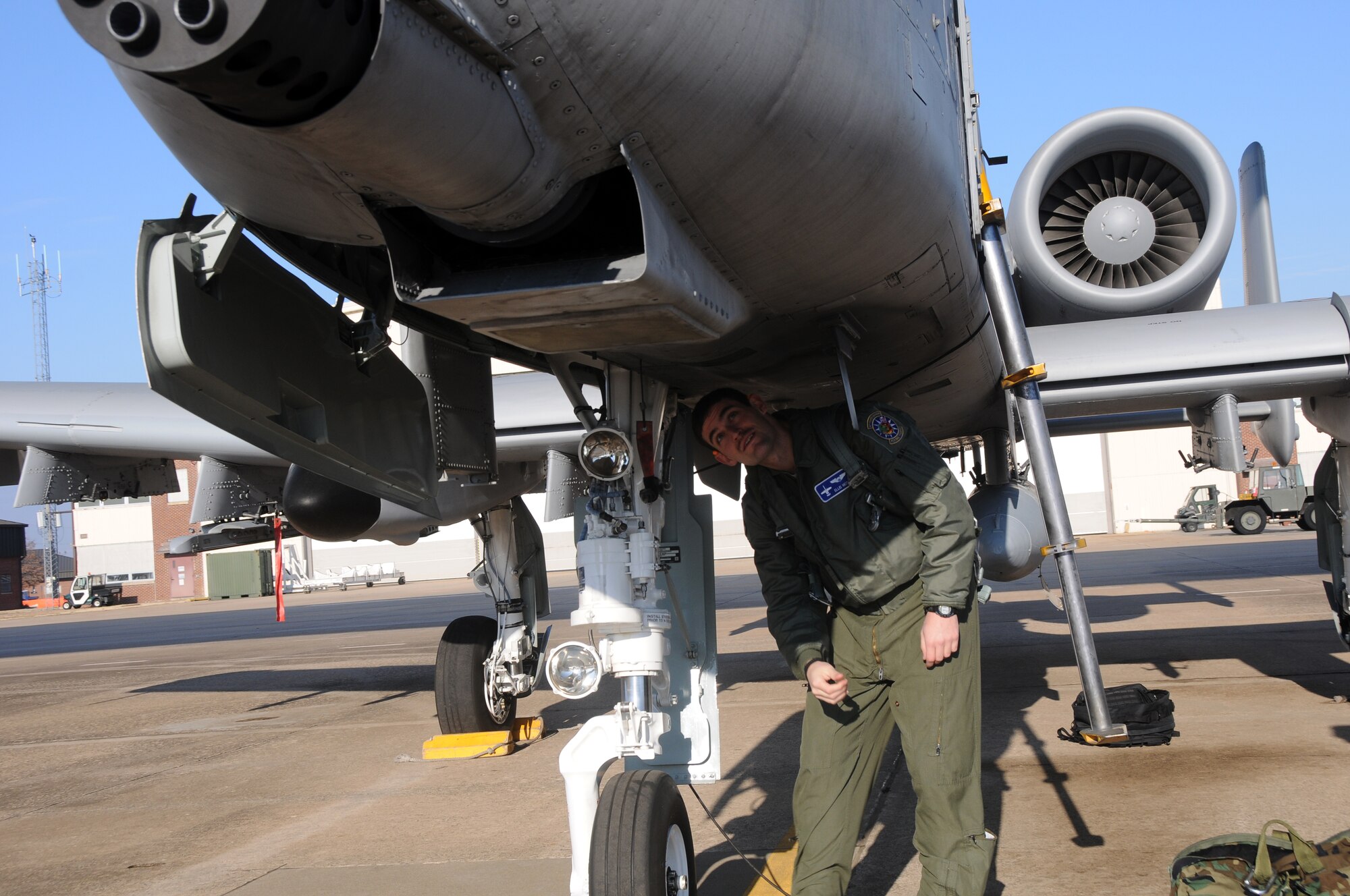 1st Lt. Ellis Moser, a pilot with the 74th Fighter Squadron, conducts preflight inspections on an A-10C Thunderbolt II "Warthog" (Tail No. 216) at Ebbing Air National Guard Base, Fort Smith, Ark. Moser delivered the aircraft from the 188th Fighter Wing to Moody Air Force Base, Ga., as part of the 188th's mission conversion from the A-10 to a remotely piloted aircraft, intelligence and targeting mission. The 188th has six remaining A-10s on station. (U.S. Air National Guard photo by Senior Airman John Hillier/released)