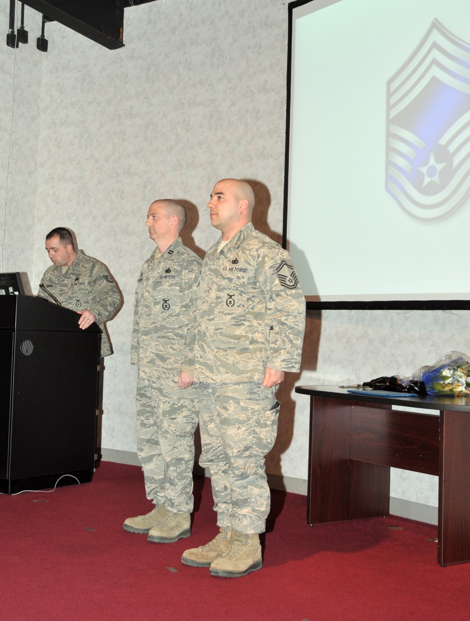STRATTON AIR NATIONAL GUARD BASE, N.Y. -- Senior Master Sgt. Joshua Walters (right), 109th Security Forces Squadron manager, is promoted to chief master sergeant by Capt. William Furmanski, 109th SFS commander, during a ceremony here March 8, 2014. (Air National Guard photo by Tech. Sgt. Catharine Schmidt/Released)