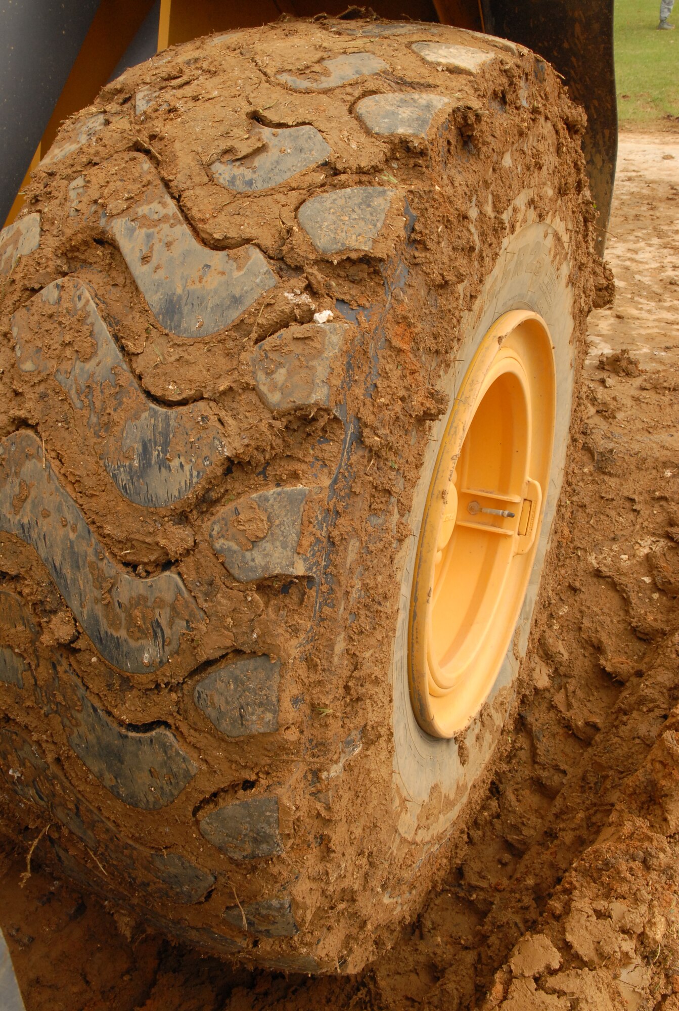 The tire on a front end loader has no trouble handling the muddy conditions of a water main break on Kadena Air Base, Japan, March 5, 2014. Thanks to the rapid response of the 18th Civil Engineer Squadron, the members were able to locate and contain the water main break, saving Kadena’s water supply. (U.S. Air Force photo by Airman 1st Class Stephen G. Eigel)