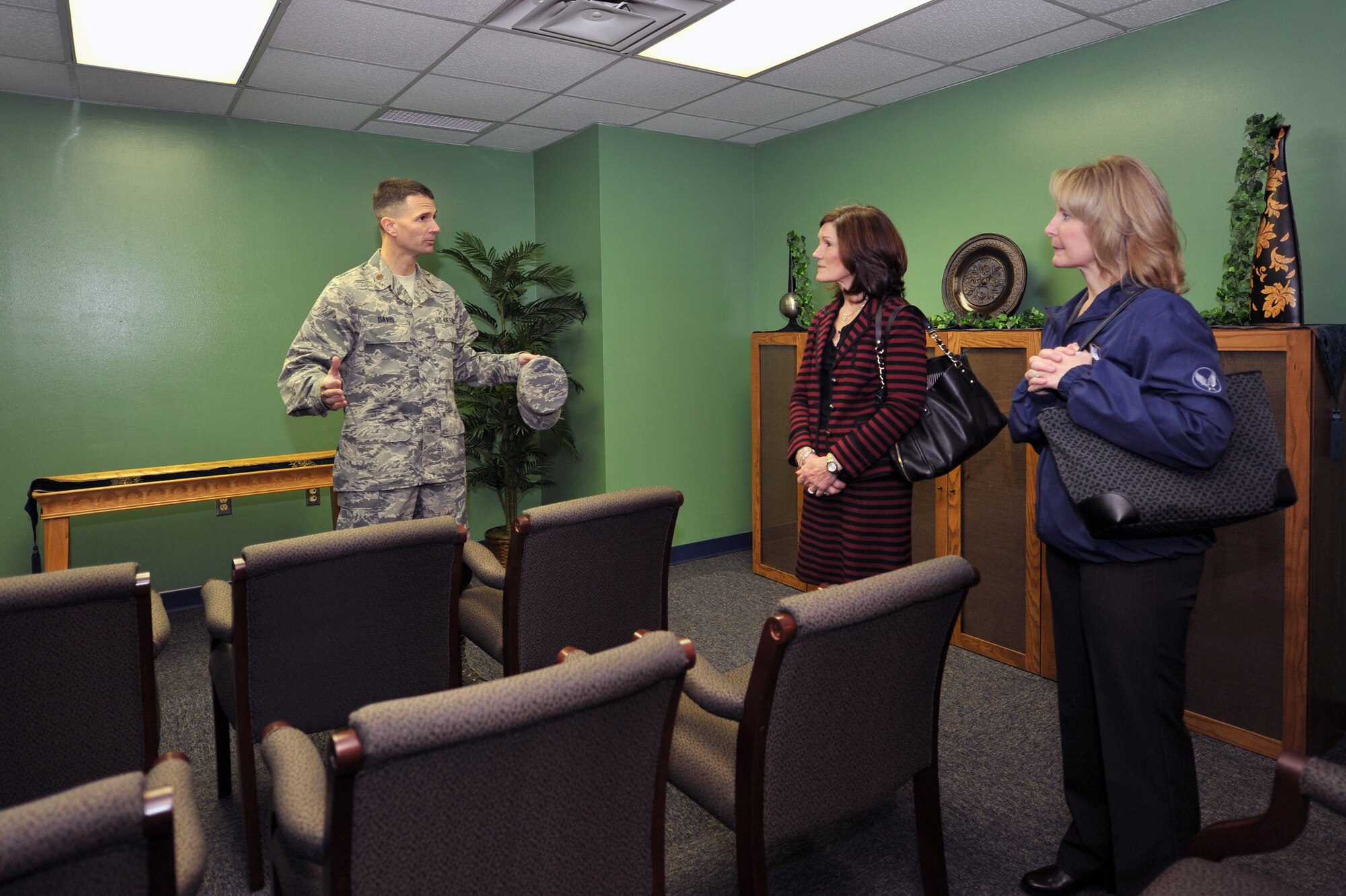 Maj. Trent Davis talks to Betty Welsh, wife of Air Force Chief of Staff Gen. Mark A. Welsh III, and Athena Cody, wife of Chief Master Sgt. of the Air Force James A. Cody, March 6, 2014, inside the Airman Resilience Center at Altus Air Force Base. The Base Chapel created the ARC to help cater to base members of all religions and create a social gathering location that can be used by all members. Davis is the 97th Air Mobility Wing head chaplain. (U.S. Air Force photo/Senior Airman Dillon Davis)