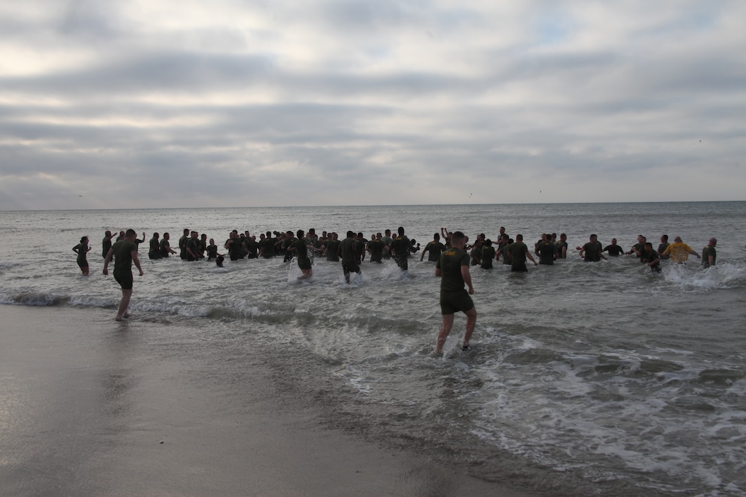 Marines with Cherry Point’s Center for Naval Aviation Technical Training run into the waters of the Atlantic Ocean Feb. 28 at Atlantic Beach. The instructors and staff members with the unit were participating in the Polar Bear Plunge.  The plunge is conducted to strengthen cohesion and build camaraderie within the unit.