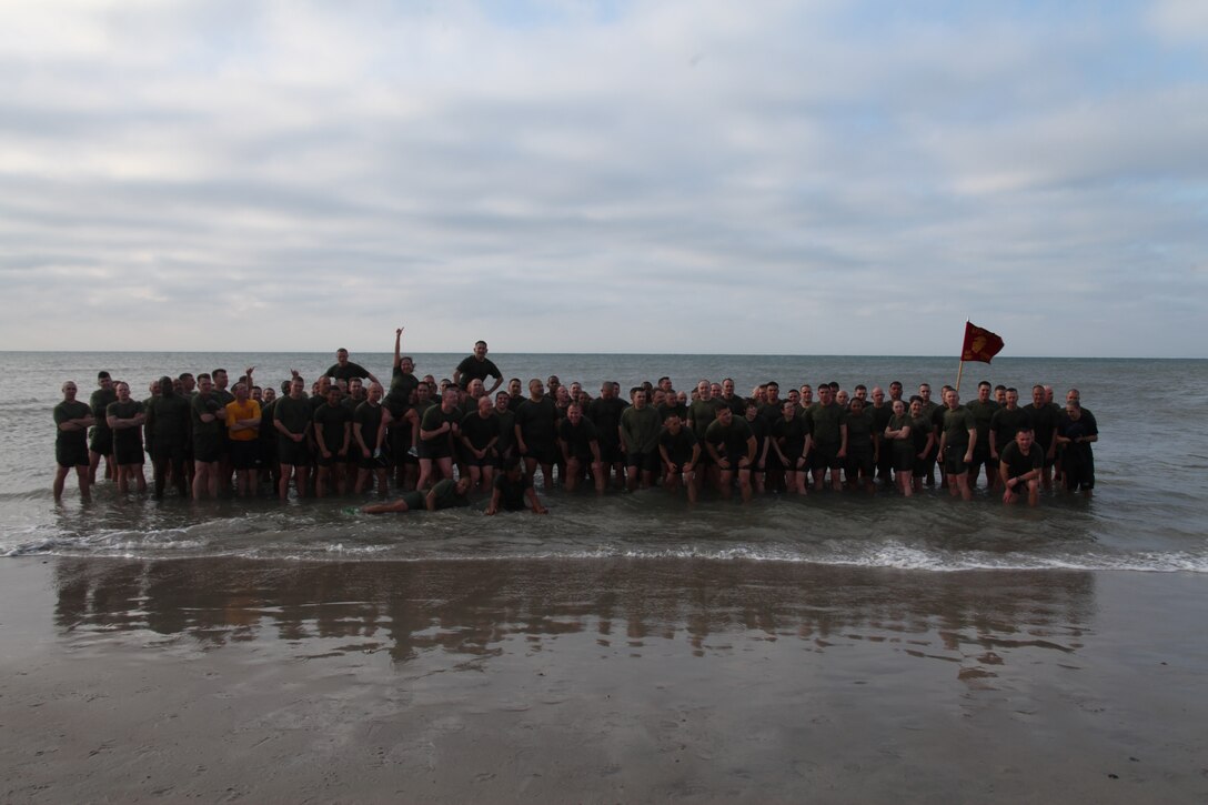 Instructors and staff members with Cherry Point's Center for Naval Aviation Technical Training pose for a photo after completing the Polar Bear Plunge Feb. 28 at Atlantic Beach. The purpose of the three-mile beach and surf run was to enhance camaraderie and strengthen unit cohesion within the training squadron.