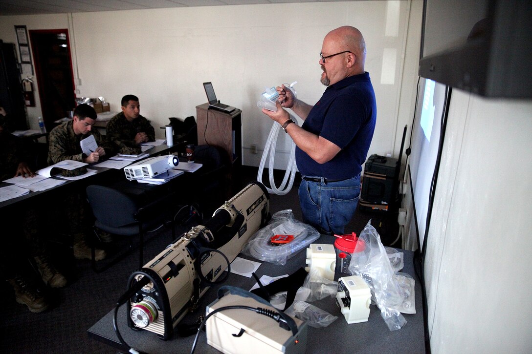 Petty Officer 3rd Class Ian Gebalski, a corpsman with Bravo Surgical Company, 1st Medical Battalion, 1st Marine Logistics Group, observes the new Portable Patient Transport Life Support System aboard Camp Pendleton, Calif., Feb. 25, 2014. The PPTLSS was designed as a lightweight, mobile replacement for the current, bulky, life-support systems used for serious injuries. It provides highly efficient components Navy personnel need to evacuate wounded Marines and sailors from the battlefield. 