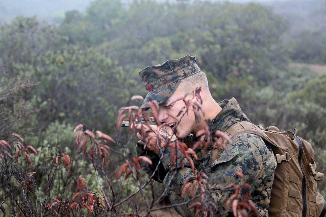 Lance Cpl. Adam Raethke, 20, engineer equipment mechanic, Landing Support Company, Combat Logistics Regiment 17, 1st Marine Logistics Group, shoots an azimuth using his compass during a land navigation course aboard Camp Pendleton, Calif. Feb. 28, 2014. Land nav. is an invaluable skill set and forms one of the core competencies of a leader. The purpose of the course is to establish individual confidence and proficiency in tasks associated with land nav. Each Marine was issued a compass, protractor and map. To complete the course, they had to locate six points within six hours.