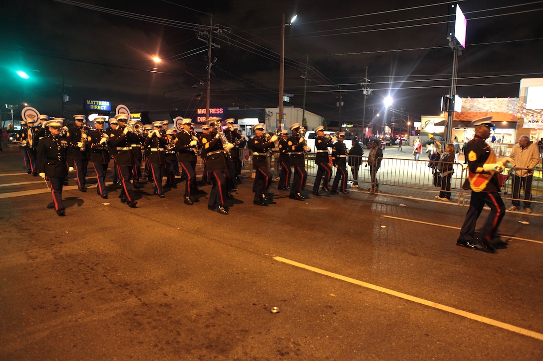 METAIRIE, La. The 2nd Marine Aircraft Wing band, from Marine Corps Air Station Cherry Point, N.C., marches in the Krewe of Zeus Mardi Gras parade in Metairie, La., March 3, 2014. Mardi Gras is such a large event in Louisiana that dozens of bands, singers and dancers from all over the country are requested to support the festivities. The 2nd MAW band and color guard volunteered their services to show their pride for the Marine Corps and to assist in the highly-demanding parade schedule. The band played songs such as Anchors Away and the Marines’ Hymn as they marched along the route.  (U.S. Marine Corps Photo by Cpl. J. Gage Karwick/Released)