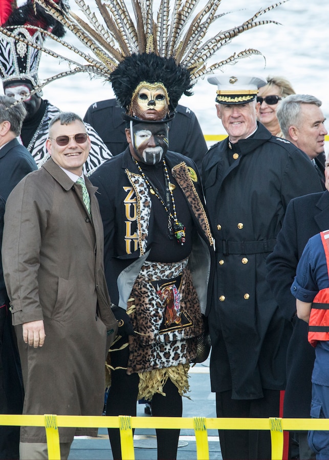 Gregg Habel, (Left) executive director for Marine Forces Reserve and Marine Forces North, Zulu Witch Doctor, and Lt. Gen. Richard P. Mills, commander of MARFORRES and MARFORNORTH, smile to the audience aboard the U.S. Coast Guard Cutter Harry Claiborne during the Lundi Gras festival in New Orleans, March 3, 2014. The armed forces community had the opportunity to participate in the 2014 Lundi Gras festival to support and strengthen the bonds between the military and its community in New Orleans. (U.S. Marine Corps photo by Lance Cpl. Mackenzie Schlueter/Released)