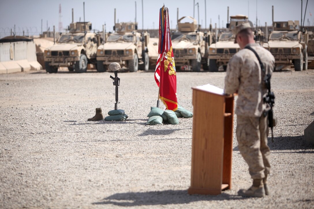 First Lt. John Matlaga, the logistics officer for Motor Transportation Platoon, 1st Battalion, 9th Marine Regiment, speaks during the memorial service for Lance Cpl. Caleb L. Erickson aboard Camp Leatherneck, Afghanistan, March 7. Erickson, of Waseca, Minn., a motor transportation mechanic stationed out of Camp Lejeune, N.C., died while conducting combat operations in Helmand province, Afghanistan, Feb. 28, 2014.