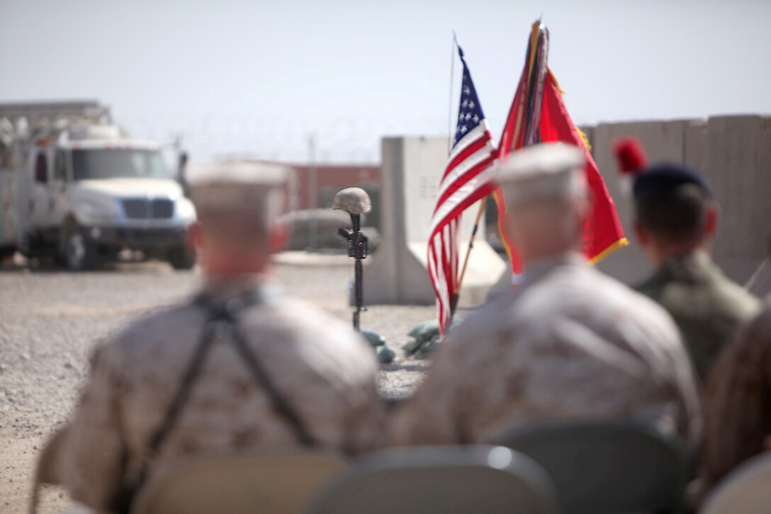 Marines and sailors with 1st Battalion, 9th Marine Regiment, attend the memorial service for Lance Cpl. Caleb L. Erickson aboard Camp Leatherneck, Afghanistan, March 7. Erickson, of Waseca, Minn., a motor transportation mechanic stationed out of Camp Lejeune, N.C., died while conducting combat operations in Helmand province, Afghanistan, Feb. 28, 2014.