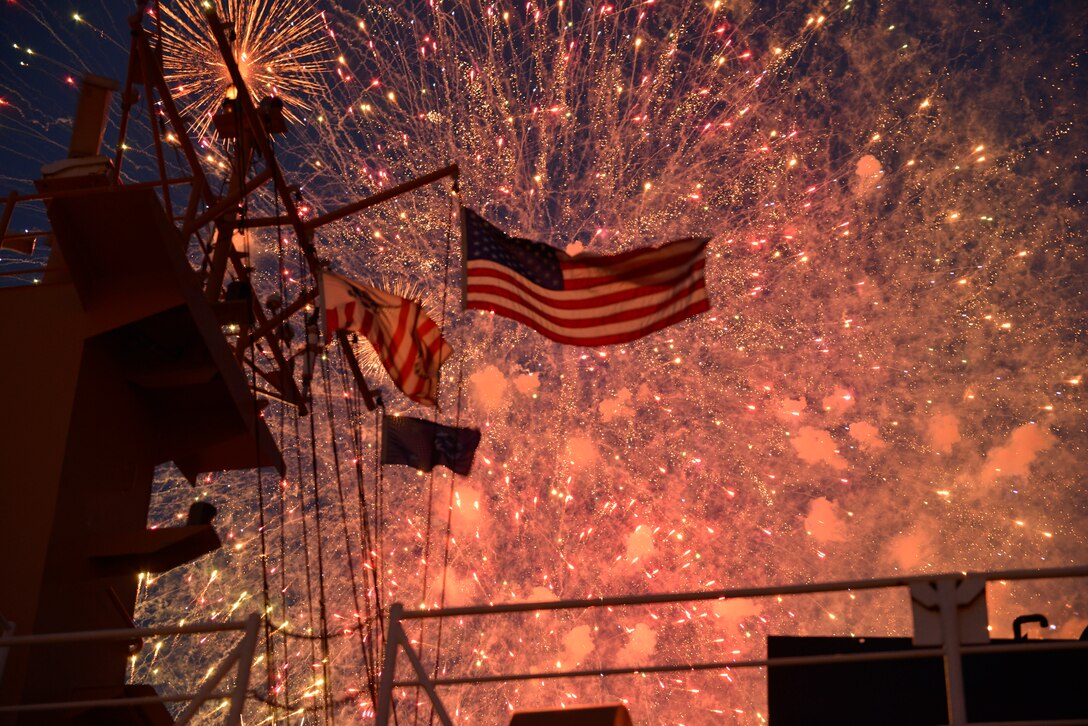 Fireworks burst above the U.S. Coast Guard Cutter Harry Claiborne moored at Spanish Plaza following the disembarkation of the Krewe of Rex, March 3, 2014. The 175-foot coastal construction tender and its crew delivered Rex and his krewe for the kickoff of Lundi Gras.  Also aboard the Cutter was Lt. Gen. Richard P. Mills, commander of MARFORRES and MARFORNORTH and Sgt. Maj. Anthony Spadaro, sergeant major of MARFORRES and MARFORNORTH. (U.S. Coast Guard photo by Petty Officer 1st Class Bill Colclough)