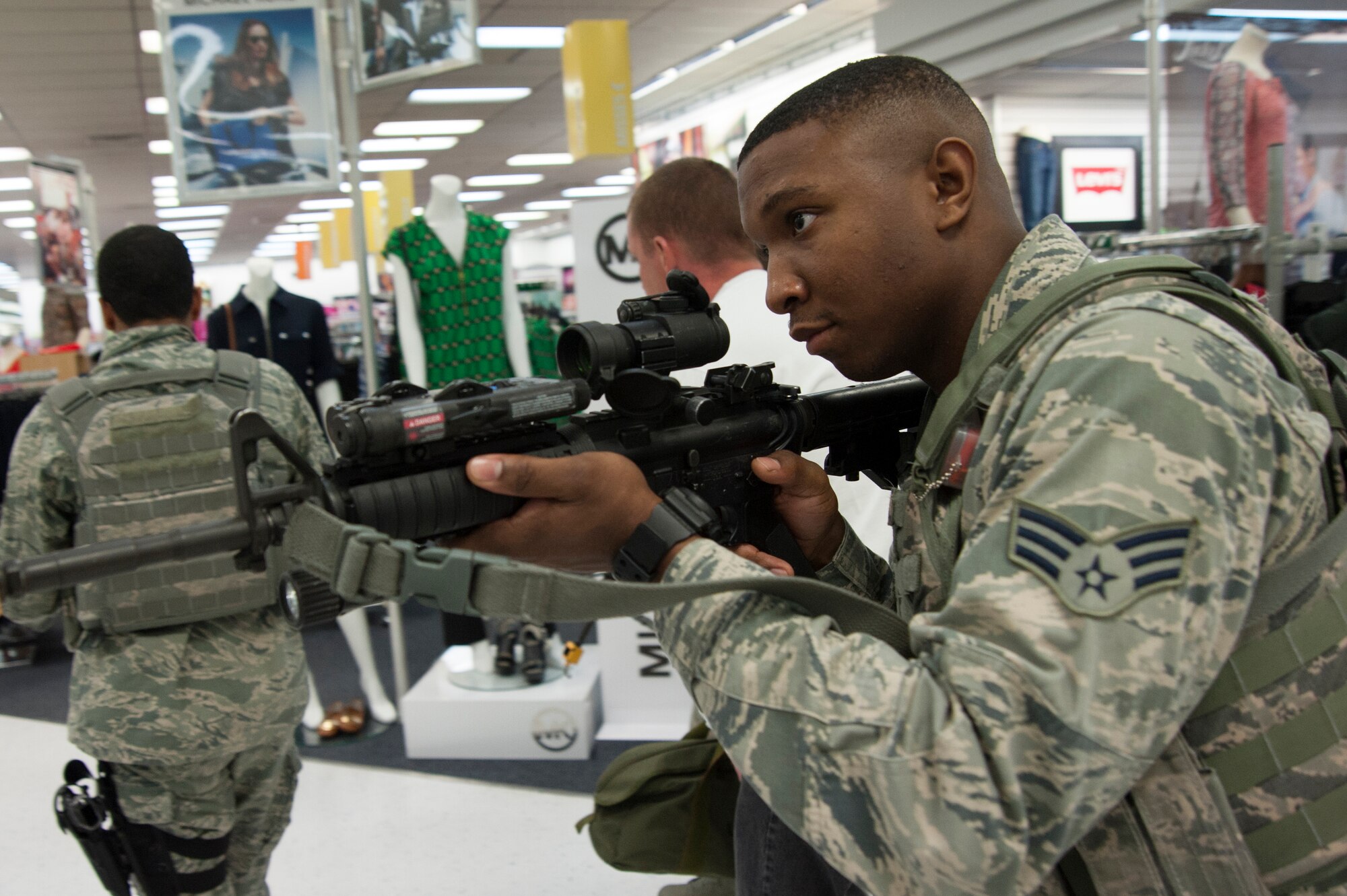 U.S. Air Force Senior Airman Tyree Porter, 35th Security Forces Squadron member, helps secure medical personnel at an active-shooter scenario during a Pacific Air Forces High Risk Response course at Misawa Air Base, Japan, March 7, 2014. Over the past four years approximately 820 PACAF security forces personnel have received this training. (U.S. Air Force photo/Staff Sgt. Nathan Lipscomb)