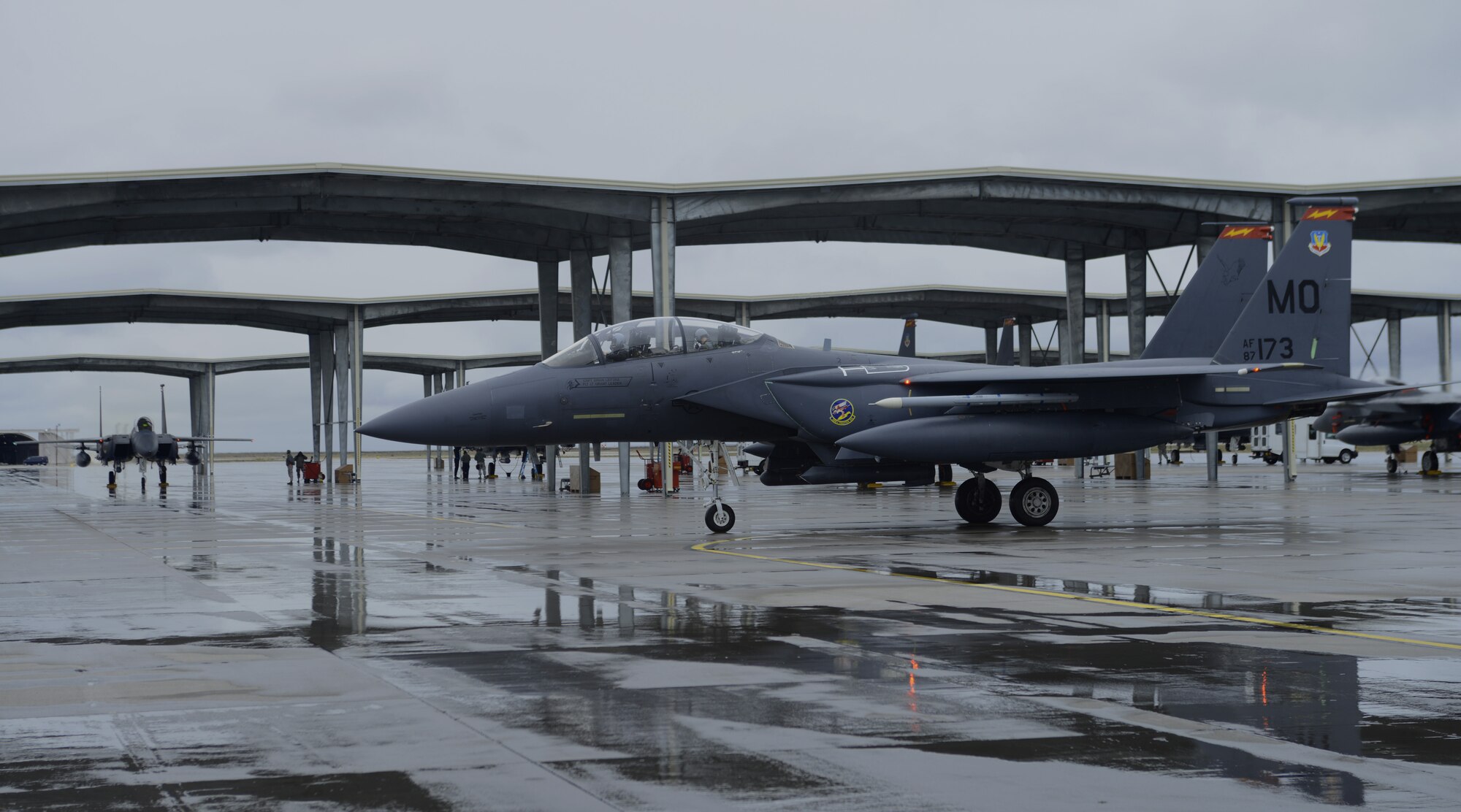 An F-15E Strike Eagle taxis toward the awaiting ground recovery crew March 10, 2014, at Mountain Home Air Force Base, Idaho. Military personnel from the U.S. Air Force, U.S. Marine Corps and British Royal Army are performing exercise operations out of MHAFB for the Gunfighter Flag military exercise March 10-14. The exercise is designed to prepare multiple joint and coalition terminal attack controller teams for upcoming deployments as well as provide proficiency training for aircrews. (U.S. Air Force photo by Senior Airman Ben Sutton/Released)