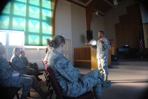 Chap. (Maj.) Steven Dabbs, 319th Air Base Wing head chaplain, provides examples of how to meet a spouse’s marital needs during the Top 5 Marital Needs of Men and Women seminar held at the Prairie Rose Chapel, Nov. 15, 2013, on Grand Forks Air Force Base, N.D. The presentation was one of several marriage-enrichment seminars offered during the base’s recent Wingman Day, which focused on spiritual and social fitness. (U.S. Air Force photo/Staff Sgt. Luis Loza Gutierrez)