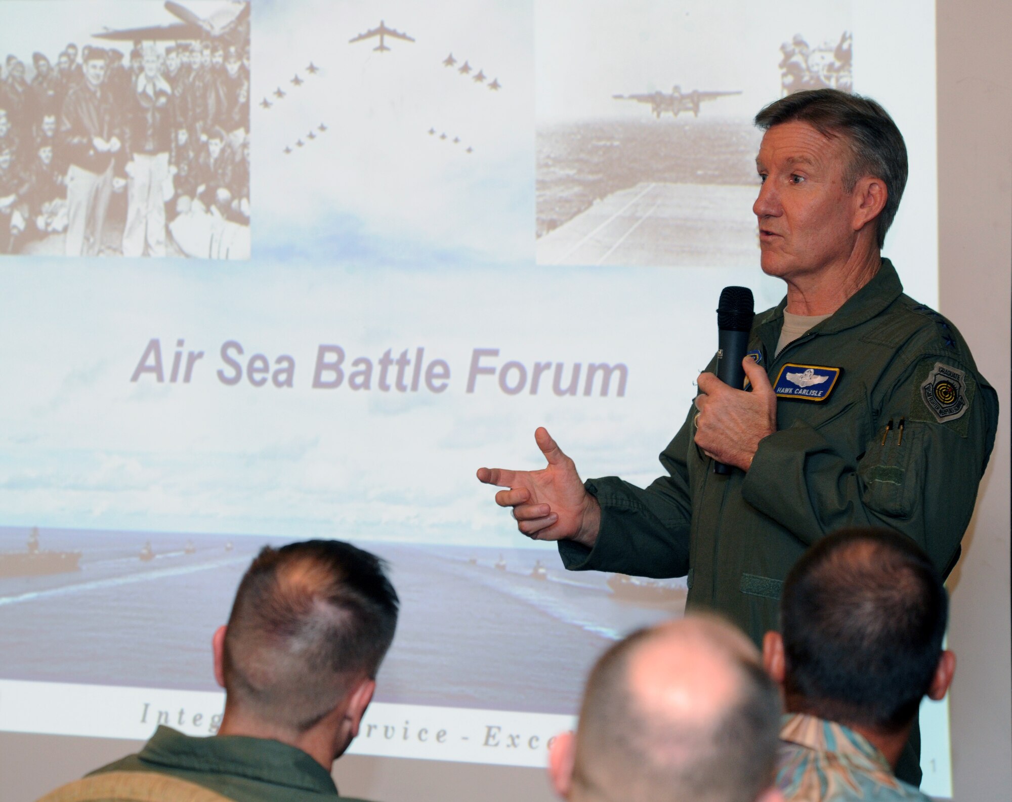 Gen. Hawk Carlisle, Pacific Air Forces commander, speaks during the Pacific Air Forces and U.S. Pacific Fleet’s first Air Sea Battle Forum March 6, 2014, at Joint Base Pearl Harbor-Hickam, Hawaii. The forum served as a venue to promote camaraderie and spark discussions between air and sea components. (U.S. Air Force photo/Master Sgt. Matthew McGovern)