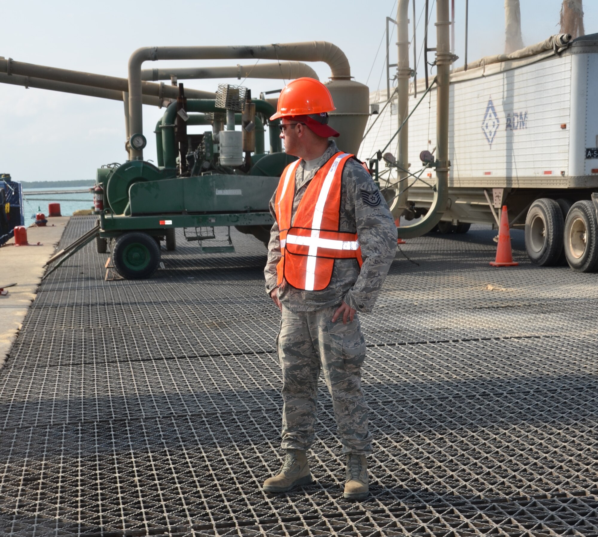 Tech. Sgt. Lance Beaver, New Horizons cargo operations, surveys the Port of Belize in preparation for the large shipment coming into port, March 7. Off-loading more the 64 pieces of equipment (vehicles and shipping containers) will take approximately 10 hours to complete. New Horizons will benefit U.S. military personnel by providing valuable training that they cannot receive at home station because of the details and logistics it takes to execute an out-of-country deployment. The process involves packing and prepping the right equipment and materials in the U.S., working with U.S. Transportation Command to have those items shipped from the U.S. to the exercise location, conducting the exercise itself and then redeploying home. (USAF photo by Master Sgt. Kelly Ogden/Released)





