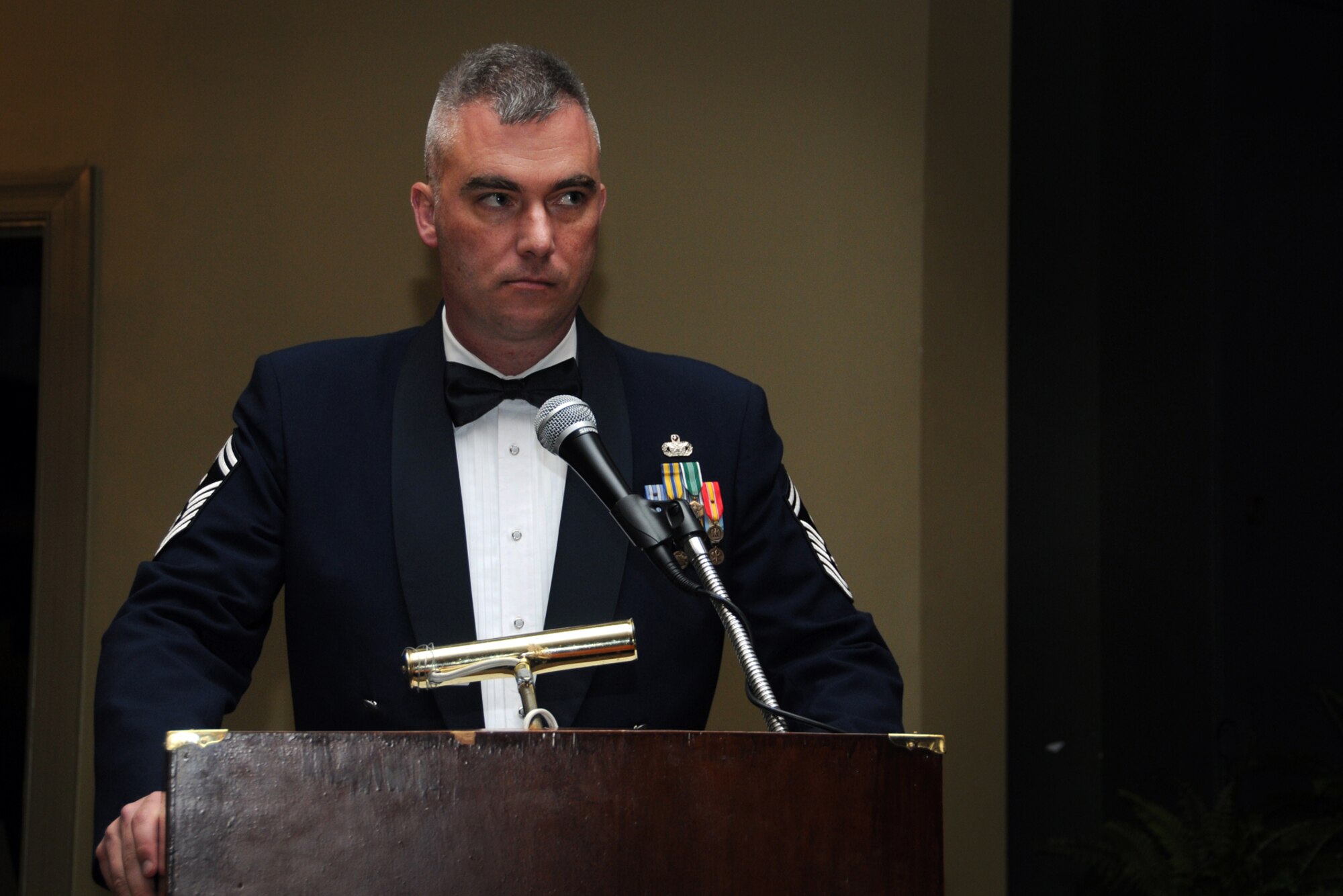 Senior Master Sgt. William Lester, 916th Security Forces Squadron, awaits the beginning of an NCO induction ceremony held at Walnut Creek Country Club, March 10. Lester served as master of ceremonies for the event. (U.S. Air Force photo by Tech. Sgt. Scotty Sweatt, 916th ARW/PA) 