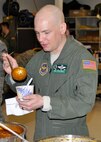 PETERSON AIR FORCE BASE, Colo. Master Sgt. Brian Beaty fills up his cup with homemade chili during the family day committee chili cook-off. In the red chili competition the winner was Russell Dunlap. The green chili category was won by Holiday Inn. There were more than twelve competitors this year. Beaty is the command chief’s executive assistant. He is assigned to the 52nd Airlift Squadron. (U.S. Air Force photo/Master Sgt. Daniel Butterfield)