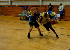 Andrew Harris, 628th Civil Engineer Squadron Team 1, drives the baseline during an intramural basketball game March 4, 2014, at the Fitness Center on Joint Base Charleston – Air Base, S.C. The 628th CES Team 1 won defeated the 628th CES Team 2, 50 to 36. (U.S. Air Force photo/ Staff Sgt. William O’Brien)