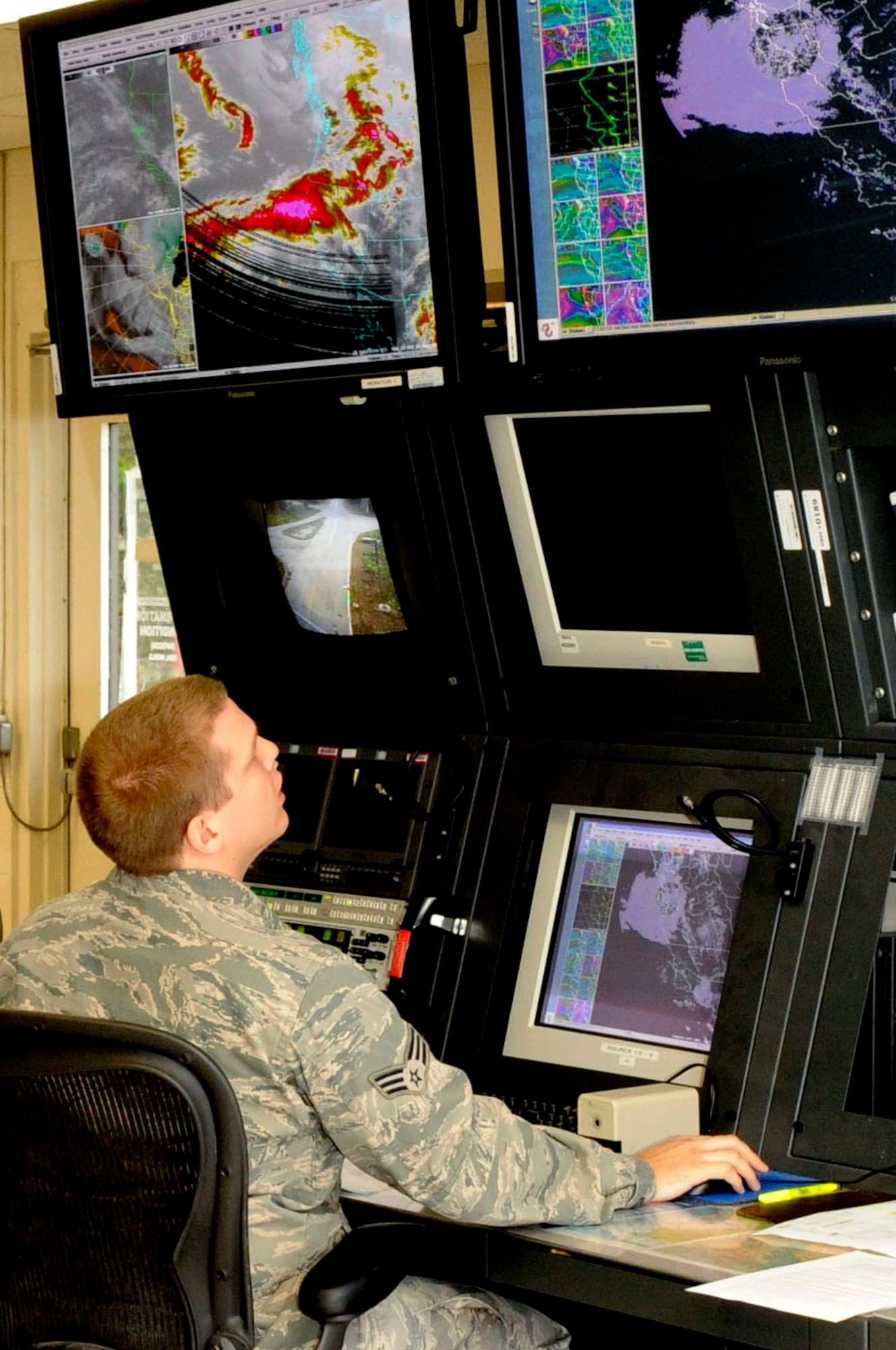 VANDENBERG AIR FORCE BASE, Calif. -- Senior Airman Daniel Tartaglione, 30th Operations Support Squadron range weather forecaster, monitors weather patterns during a metrological briefing here, March 4. At VAFB a primary mission is achieving successful polar-orbital launches, which would not happen without dedicated personnel from various organizations, like the members of the 30th OSS weather flight. (U.S. Air Force photo/ Senior Airman Shane Phipps)