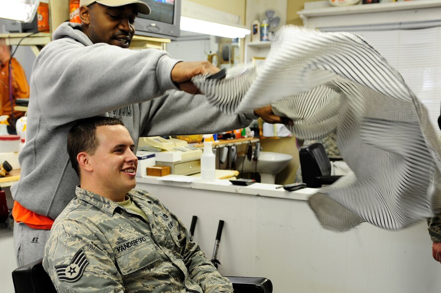 U.S. Air Force Staff Sgt. Jonathan Vanderford, 20th Logistics Readiness Squadron NCO in charge of training validations and operations, prepares to have his head shaved, Sumter, S.C., March 5, 2014. Vanderford was one of the Airmen from LRS to shave his head for a fellow Airman who was diagnosed with cancer. (U.S. Air Force photo by Airman 1st Class Diana M. Cossaboom/Released)