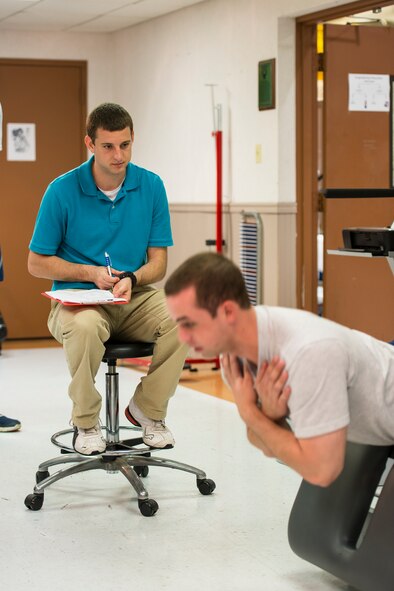 Sean Amos, a senior student at Valdosta State University, conducts post deployment physical evaluations at Moody Air Force Base, Ga., Feb. 21, 2014. Amos is one of two VSU students working as an intern at Moody as part of a new partnership between the installation and the university. (U.S. Air Force photo by Airman 1st Class Ryan Callaghan/Released)