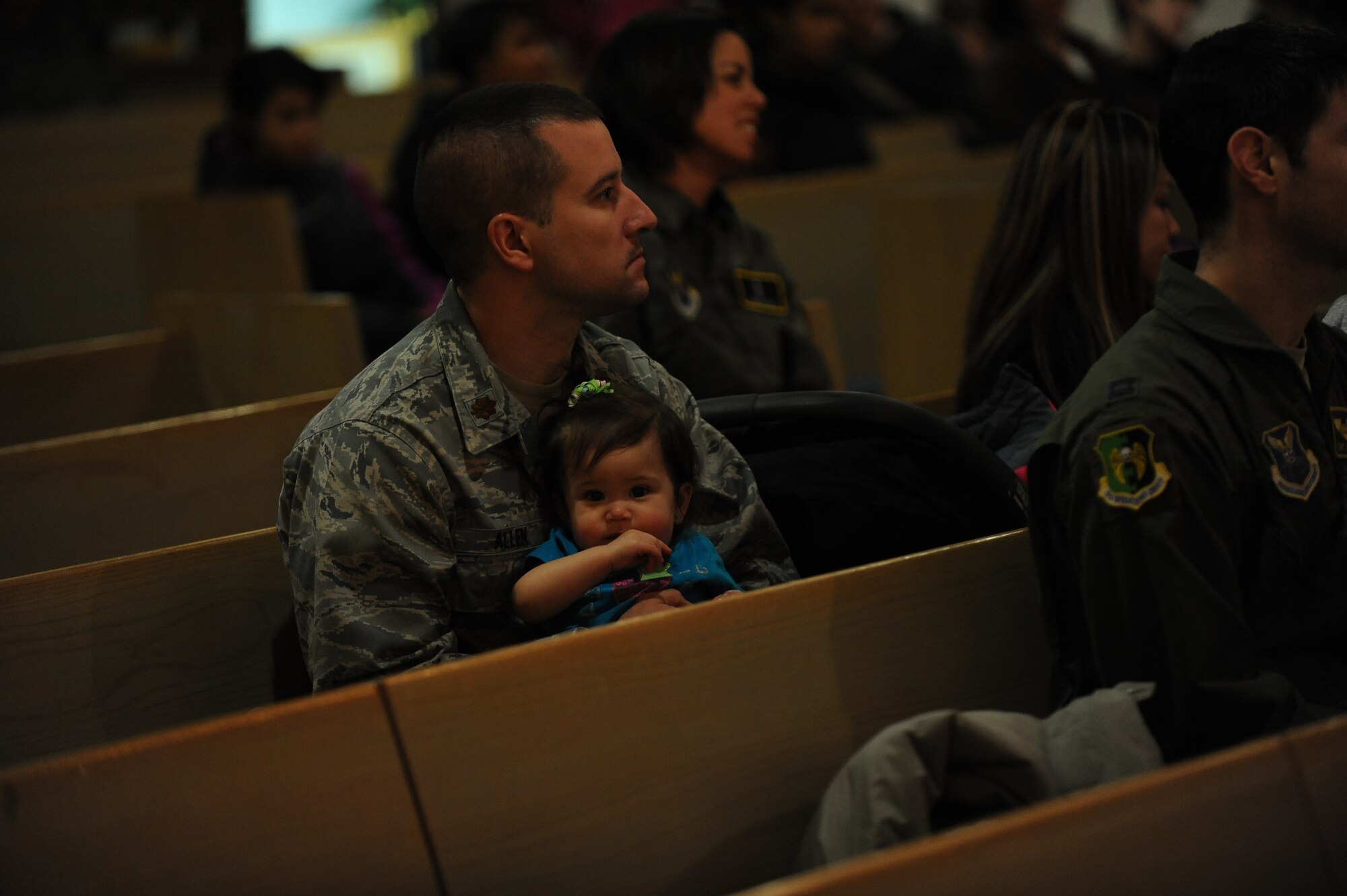 Capt. Piotr Gadja, 5th Bomb Wing Catholic chaplan, led two masses on Ash Wednesday, Mar. 5, 2014 to mark the beginning of Lent. Lent, which is 40 days long, ending on Easter Sunday, is a time for members of the Catholic Church to reset, reevaluate, and make personal sacrifices that may ultimately improve their lifestyle. Using the ashes of burnt palms, Catholics wear the mark of a cross on their foreheads as a symbol of Ash Wednesday. (U.S. Air Force photos/Airman 1st Class Lauren Pitts)