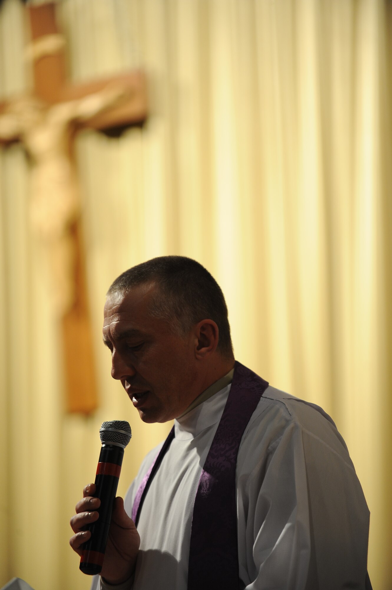 Capt. Piotr Gadja, 5th Bomb Wing Catholic chaplan, led two masses on Ash Wednesday, Mar. 5, 2014 to mark the beginning of Lent. Lent, which is 40 days long, ending on Easter Sunday, is a time for members of the Catholic Church to reset, reevaluate, and make personal sacrifices that may ultimately improve their lifestyle. Using the ashes of burnt palms, Catholics wear the mark of a cross on their foreheads as a symbol of Ash Wednesday. (U.S. Air Force photos/Airman 1st Class Lauren Pitts)