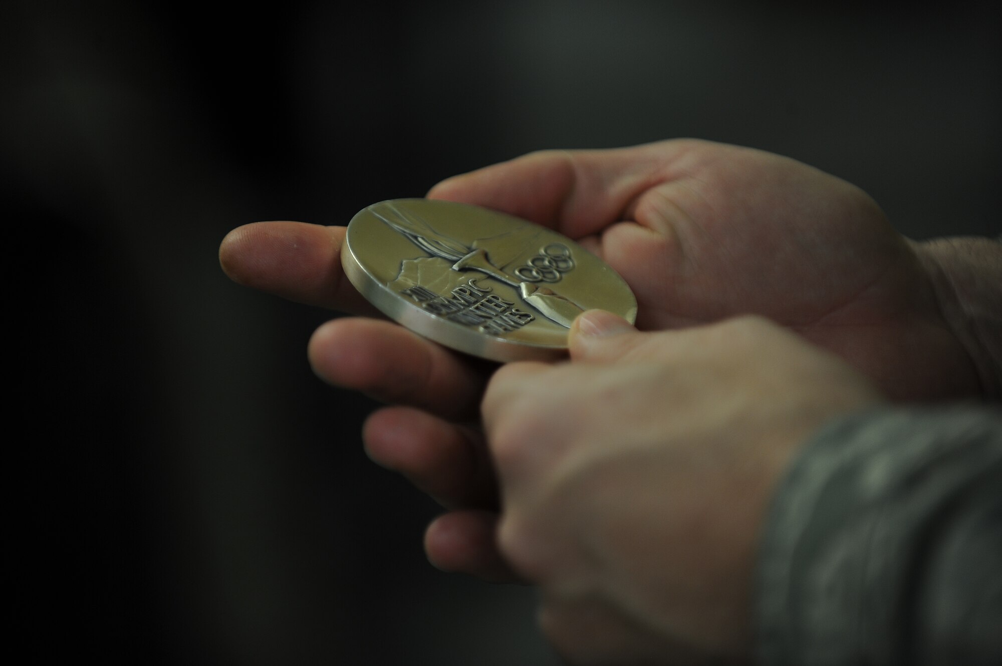 The American 300 tour visited Minot Air Force Base Airmen led by founder Robi Powers, and three special guests.  Olympic medalists Phil and Steve Mahre, and X Games medalist Erin Nemec, joined Powers in sharing their stories of failure and triumph through their careers, and the importance of teamwork and camaraderie.  Passing their medals from Airman to Airman, the Olympians made a point to share their victories with the service men and women of the United States, stating that a win for an American Olympian, is a win for America. (U.S. Air Force photos/Airman 1st Class Lauren Pitts)