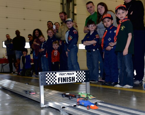 Cub Scouts and family members cheer on racing cars March 8, 2014, during the Mayflower Pinewood Derby on RAF Mildenhall, England. The derby was open to any Cub Scout in the Mayflower District, regardless of where they placed in their own Cub Scout pack’s races. The Mayflower District includes Cubs from the U.K. and Norway. (U.S. Air Force photo by Airman 1st Class Preston Webb/Released)