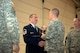 Maj. Gen. James A. Hoyer, Adjutant Generla of West Virginia, presents the James Kemp McLaughlin trophy, awarded to West Virginia's top airman, to Master Sgt. David Martens during an awards ceremony for the Wing's Outstanding Airmen of the Year, March 1. (Air National Guard photo by Tech. Sgt. Michael Dickson/Released) 
