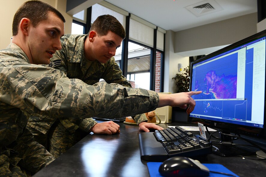 U.S. Air Force 1st Lt. Grant Talkington, 20th Fighter Wing weather officer, trains Senior Airman Kristofer Moody, 20th Operations Support Squadron weather forecaster, on a Gibson Ridge radar software at Shaw Air Force Base, S.C. March 5, 2014. The 13 weather flight Airmen prepare for an upcoming severe weather season by training on the new radar software which gives them 3D viewing capabilities. (U.S. Air Force photo by Airman 1st Class Jensen Stidham/Released)