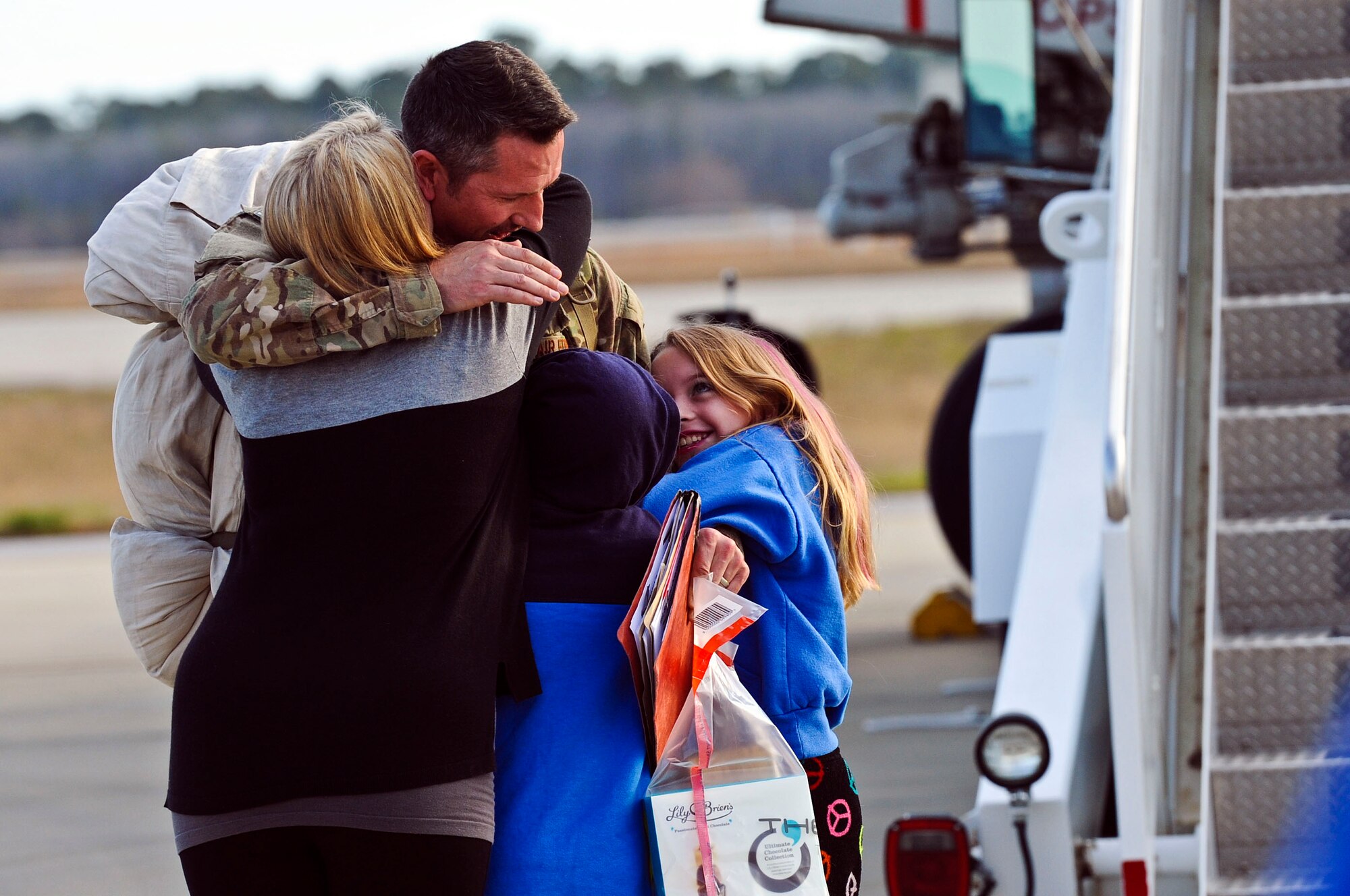 Family members, friends and fellow Air Commandos gather to welcome home more than 100 Hurlburt Airmen at the 9th Aircraft Maintenance Unit Hangar on Hurlburt Field, Fla., March 9, 2014. The Airmen in-processed through such functions as medical and finance on site. (U.S. Air Force photo/Senior Airman Michelle Patten)