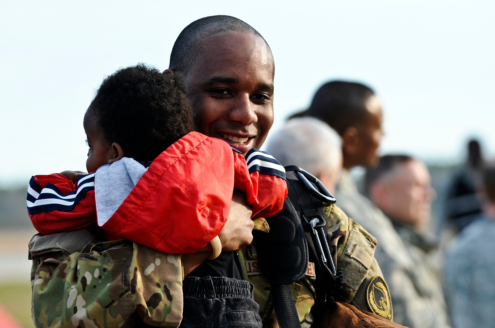 Family members, friends and fellow Air Commandos gather to welcome home more than 100 Hurlburt Airmen at the 9th Aircraft Maintenance Unit Hangar on Hurlburt Field, Fla., March 9, 2014. The Airmen in-processed through such functions as medical and finance on site. (U.S. Air Force photo/Senior Airman Michelle Patten)