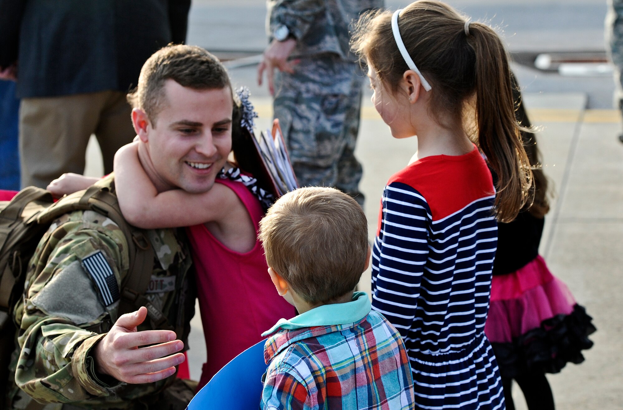 Family members, friends and fellow Air Commandos gather to welcome home more than 100 Hurlburt Airmen at the 9th Aircraft Maintenance Unit Hangar on Hurlburt Field, Fla., March 9, 2014. The Airmen in-processed through such functions as medical and finance on site. (U.S. Air Force photo/Senior Airman Michelle Patten)