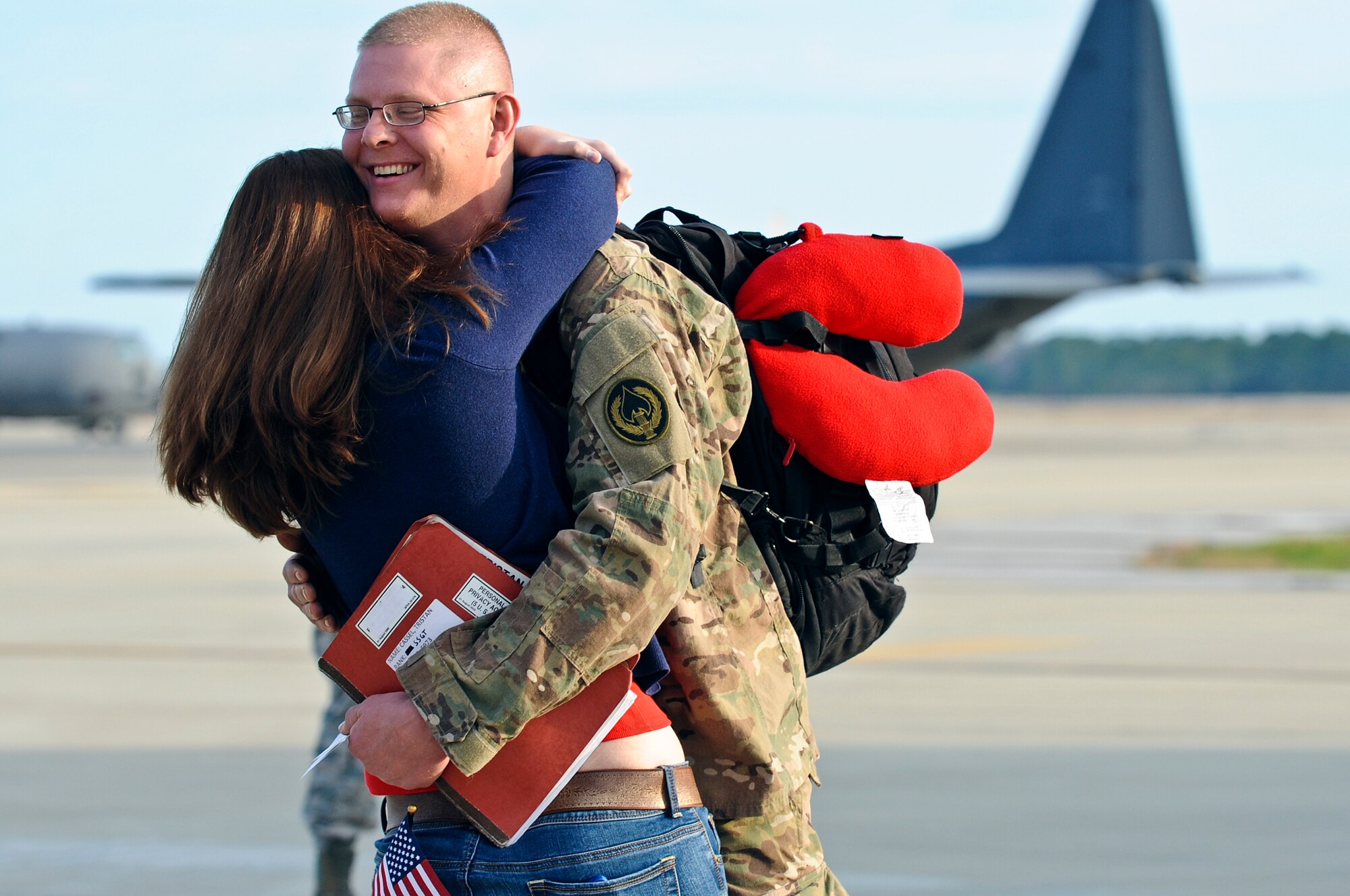 Family members, friends and fellow Air Commandos gather to welcome home more than 100 Hurlburt Airmen at the 9th Aircraft Maintenance Unit Hangar on Hurlburt Field, Fla., March 9, 2014. The Airmen in-processed through such functions as medical and finance on site. (U.S. Air Force photo/Senior Airman Michelle Patten)