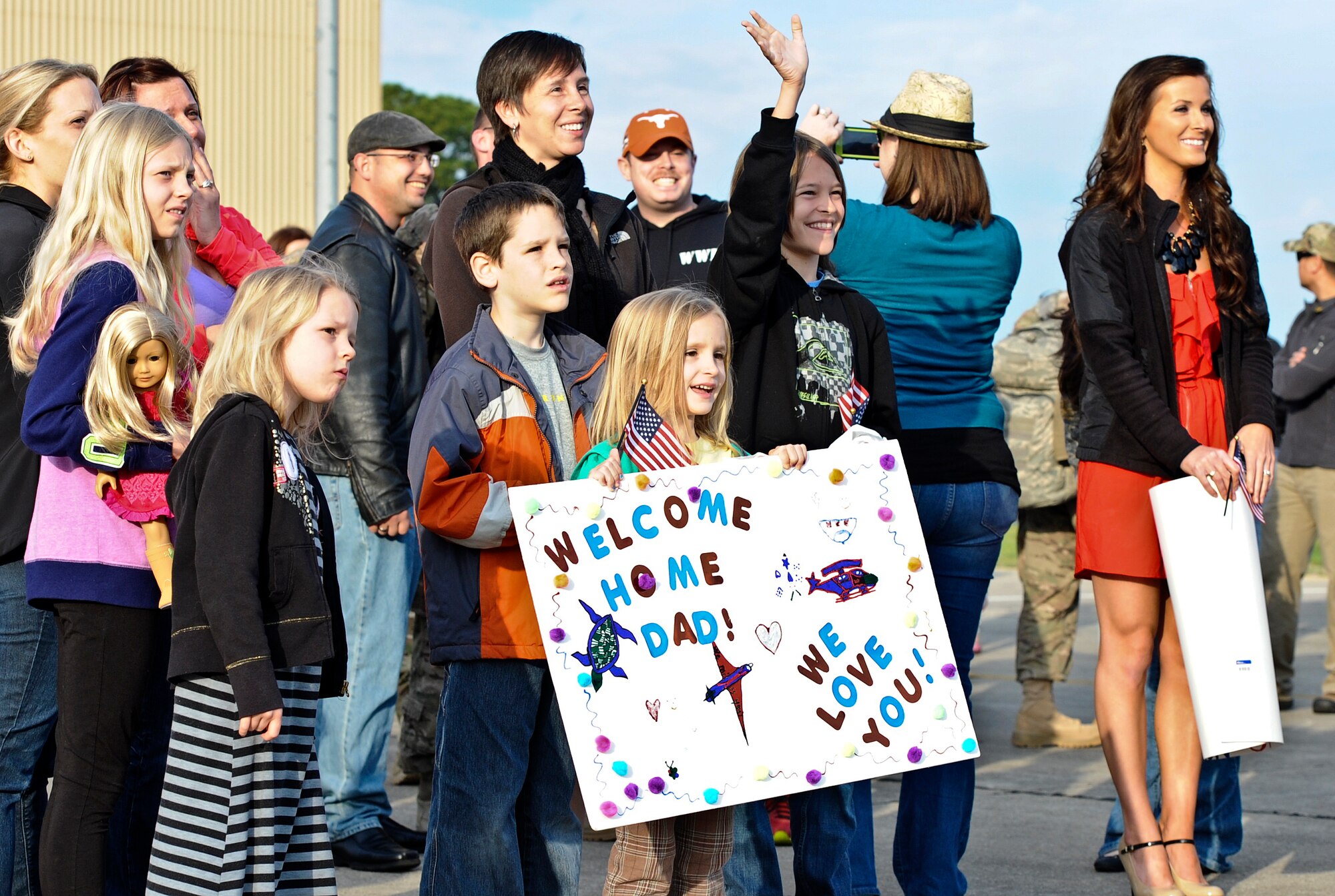 Family members, friends and fellow Air Commandos gather to welcome home more than 100 Hurlburt Airmen at the 9th Aircraft Maintenance Unit Hangar on Hurlburt Field, Fla., March 9, 2014. The Airmen in-processed through such functions as medical and finance on site. (U.S. Air Force photo/Senior Airman Michelle Patten)