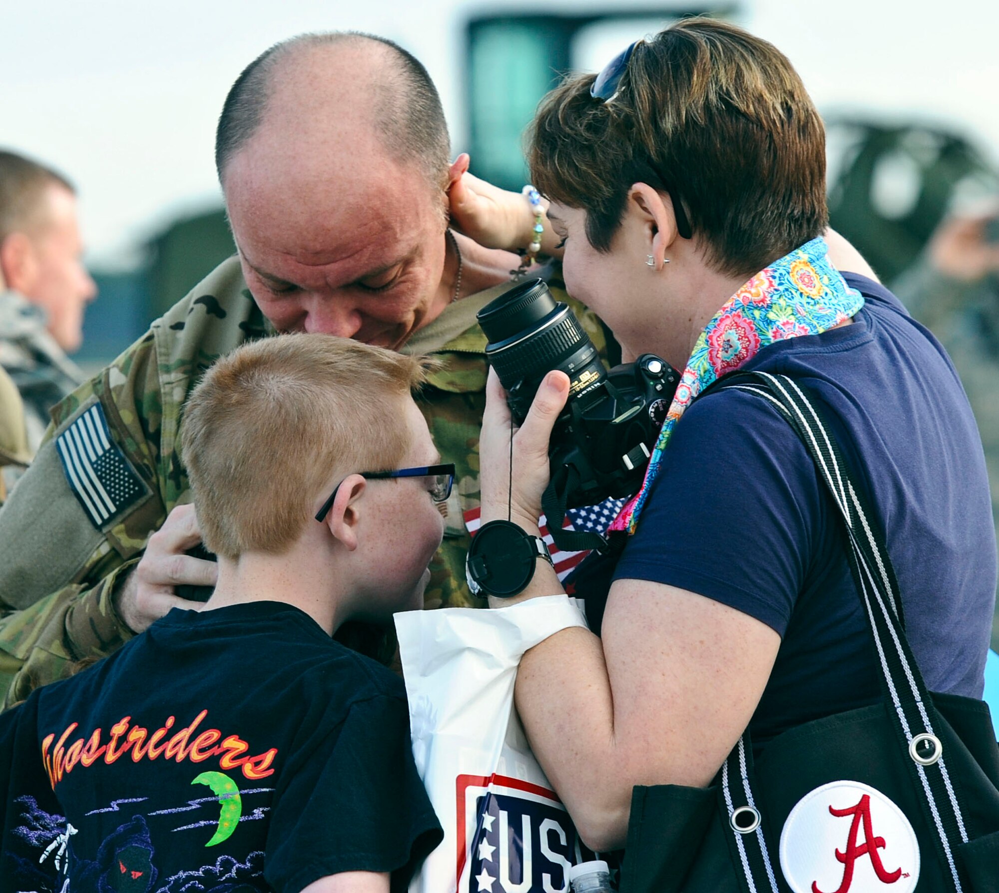 Family members, friends and fellow Air Commandos gather to welcome home more than 100 Hurlburt Airmen at the 9th Aircraft Maintenance Unit Hangar on Hurlburt Field, Fla., March 9, 2014. The Airmen in-processed through such functions as medical and finance on site. (U.S. Air Force photo/Senior Airman Michelle Patten)