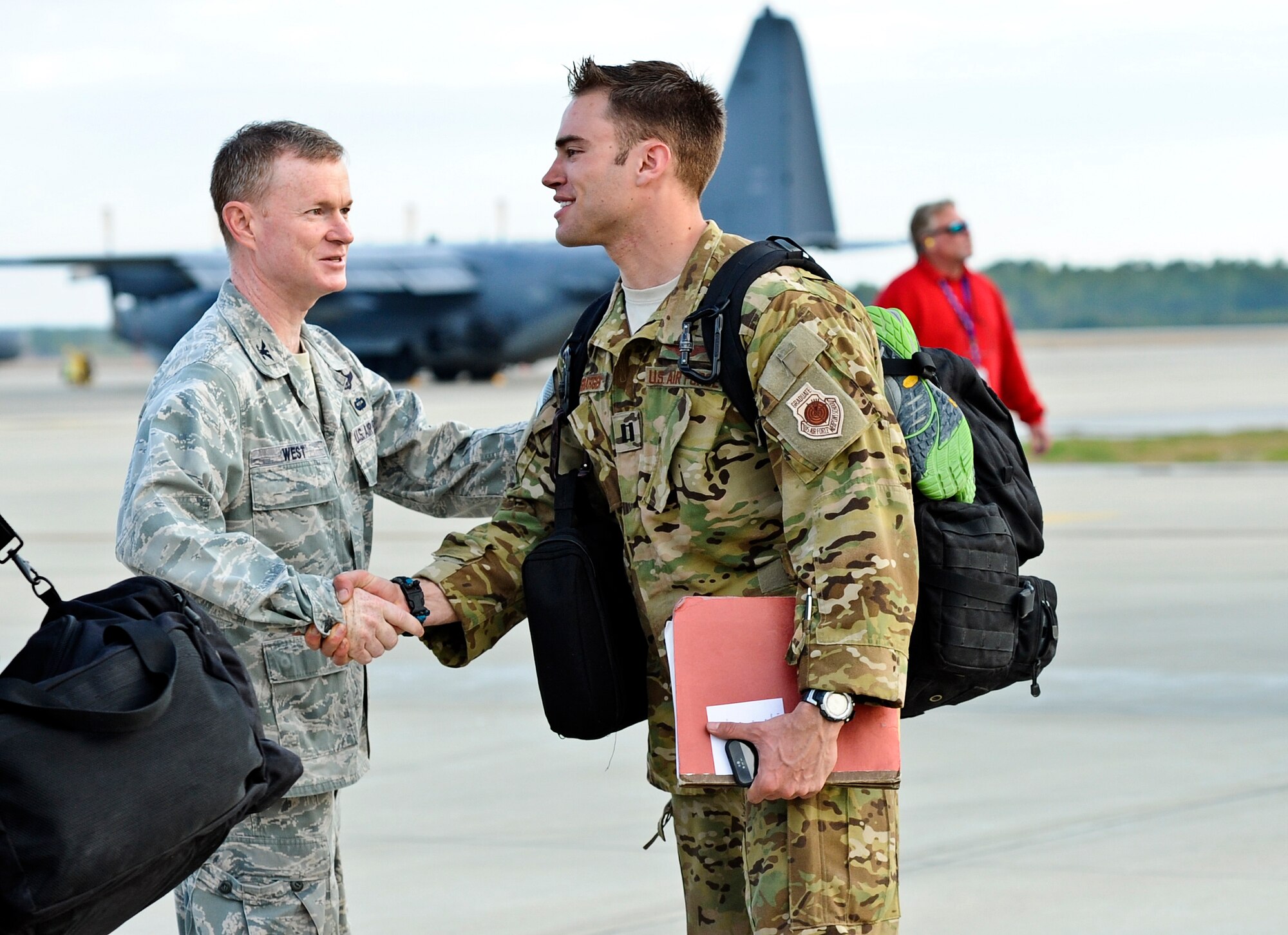 Family members, friends and fellow Air Commandos gather to welcome home more than 100 Hurlburt Airmen at the 9th Aircraft Maintenance Unit Hangar on Hurlburt Field, Fla., March 9, 2014. The Airmen in-processed through such functions as medical and finance on site. (U.S. Air Force photo/Senior Airman Michelle Patten)