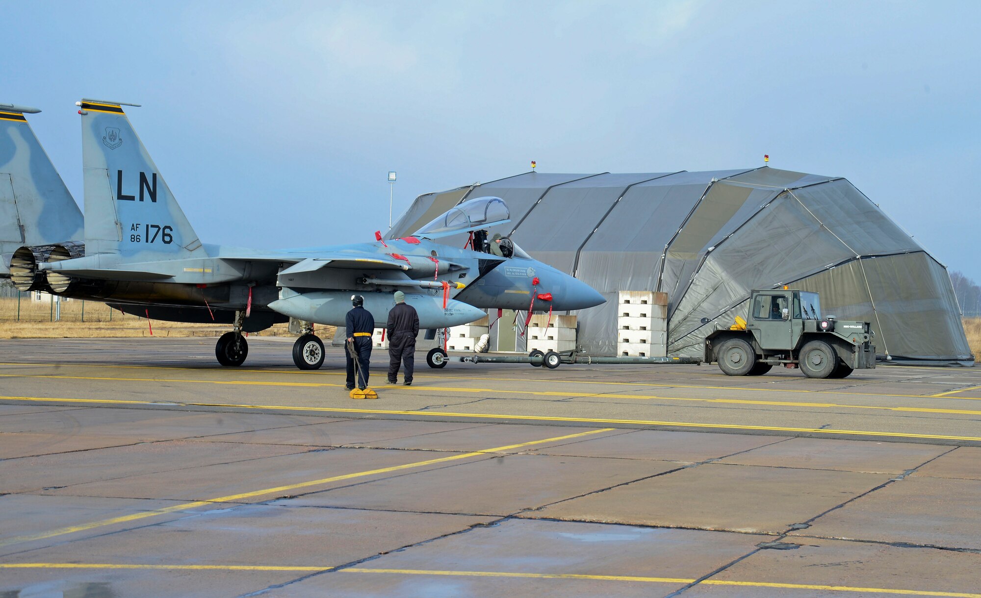 Airmen and aircraft from the 48th Air Expeditionary Group maintain a U.S. Air Force presence at Siauliai Air Base, Lithuania, March 7, 2014. The 48th Fighter Wing at Royal Air Force Lakenheath, England, sent an additional six aircraft and more than 50 personnel, to augment the four aircraft and approximately 150 Airmen already supporting NATO's ongoing air policing mission since January 2014, at the request of U.S. allies in the Baltics. (U.S. Air Force photo by Airman 1st Class Dana J. Butler/Released by Tech. Sgt. Sanjay Allen, U.S. European Command Media Operations)
