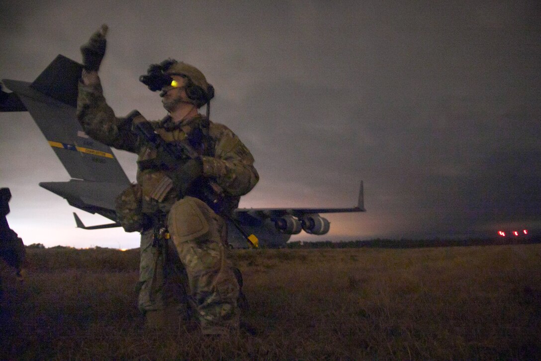 An Air Force special operations weather technician measures wind speed during a multilateral airborne operation with Army Rangers on Tyndall Air Force Base, Fla., March 3, 2014.