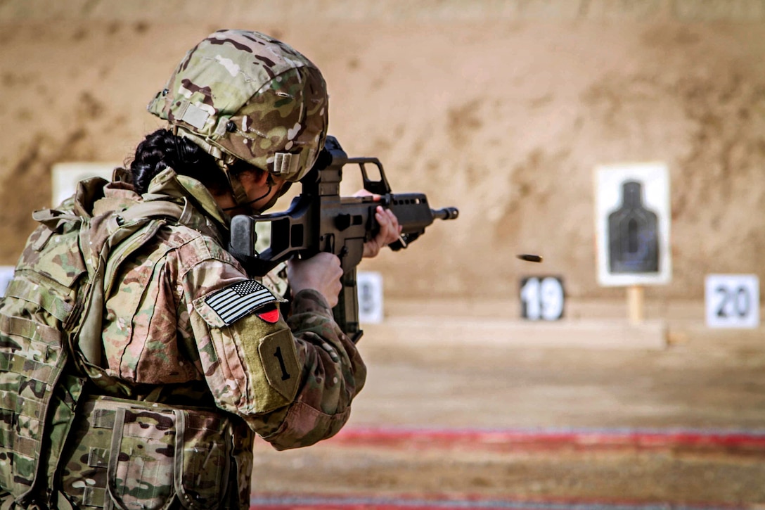 U.S. Army Spc. Amanda Luna fires a German G36 rifle during the ...