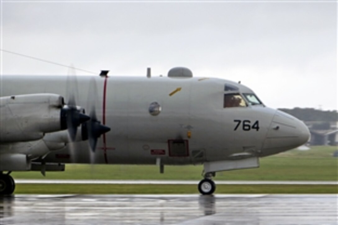 A P-3C Orion patrol craft departs from Kadena Air Base in Okinawa, Japan, March 9, 2014, to aid in the search of the missing the Malaysia Airlines flight. The P-3C brings long-range search, radar and communications capabilities to the efforts. The flight, which dropped off the radar of Subang, Indonesia, traffic controllers early Saturday morning while over the South China Sea, had 227 passengers from 14 nations and 12 crew members. 