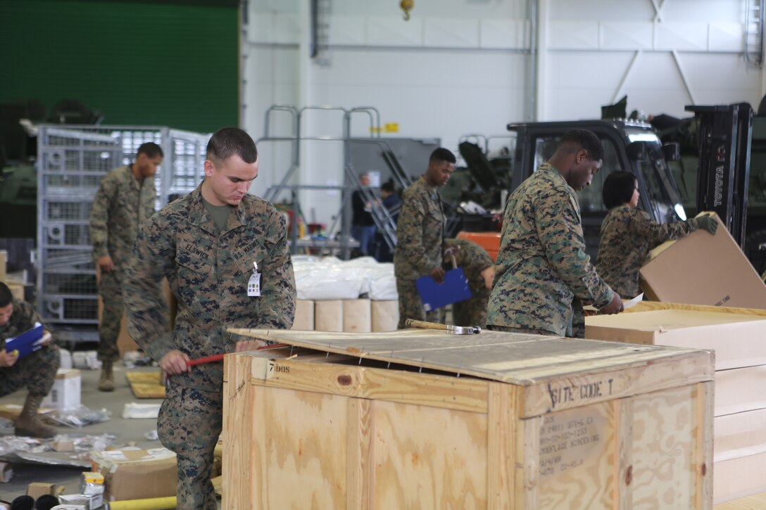 Marines with 2nd Supply Battalion, Combat Logistics Regiment 25, 2nd Marine Logistics Group open obsolete crates before repacking the stored equipment into more space efficient casings at Tromsdal, Norway, March 07, 2014. The Marines also conducted maintenance on damaged equipment to ensure safety during Cold Response 2014 and future operations. Cold Response 2014 is a Norwegian-led multinational exercise above the Arctic Circle designed prepare for crisis-response operations.