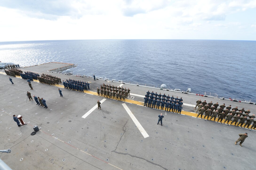 Marines and sailors of the 31st Marine Expeditionary Unit, Amphibious Squadron 11 and USS Bonhomme Richard (LHD-6), stand in formation during a ceremony to commemorate the victims of the March 2011 Tohoku earthquake and tsunami on the flight deck of the USS Bonhomme Richard (LHD-6), Mar. 11. During Operation Tomodachi, the 31st MEU and PHIBRON-11 distributed 164,000 pounds of food, thousands of gallons of water and other relief supplies to Kesennuma, Oshima Island and other areas throughout the Honshu region. Colonel John Merna, commanding officer of the 31st MEU and a native of Prince George’s County, Md., said, “General Mattis once said that when it comes to U.S. Marines, there is no better friend, no worse enemy. The friendships made with the people of Oshima Island, for example, continue to this day. The history of the 31st MEU - PHIBRON-11 team will be forever linked to the people of Oshima Island.” The 31st MEU is currently conducting amphibious integration training alongside PHIBRON-11 while deployed for its regularly-scheduled Spring Patrol. The 31st MEU is the Marine Corps’ force of choice for the Asia-Pacific region and is the only continuously forward-deployed MEU.