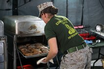 Cpl. Khari D. Marshall, a Reading, Pa., native and chief cook with Food Service Company, Combat Logistics Regiment 27, 2nd Marine Logistics Group, takes potatoes out of an Enhanced Tray Ration Heating System at a field mess site during the W.P.T. Hill Award competition aboard Camp Lejeune, N.C., March 10, 2014. The W.P.T. Hill Award was established in 1985 to improve food service operations and recognize the best field and garrison messes in the Marine Corps. Competitors are judged on areas such as operations, sanitation, taste and quality of food. 