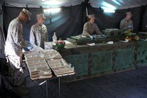 Marines from various units within 2nd Marine Logistics Group listen to thorough instructions on how to serve the food at a field mess site during the W.P.T. Hill Award competition aboard Camp Lejeune, N.C., March 10, 2014. The Marines prepared shepherd’s pie, white beans and chicken chili, and grilled steak for the main entrées. Side choices were rice, cornbread, baked potatoes and biscuits. A separate fruit and salad bar was set up as well.