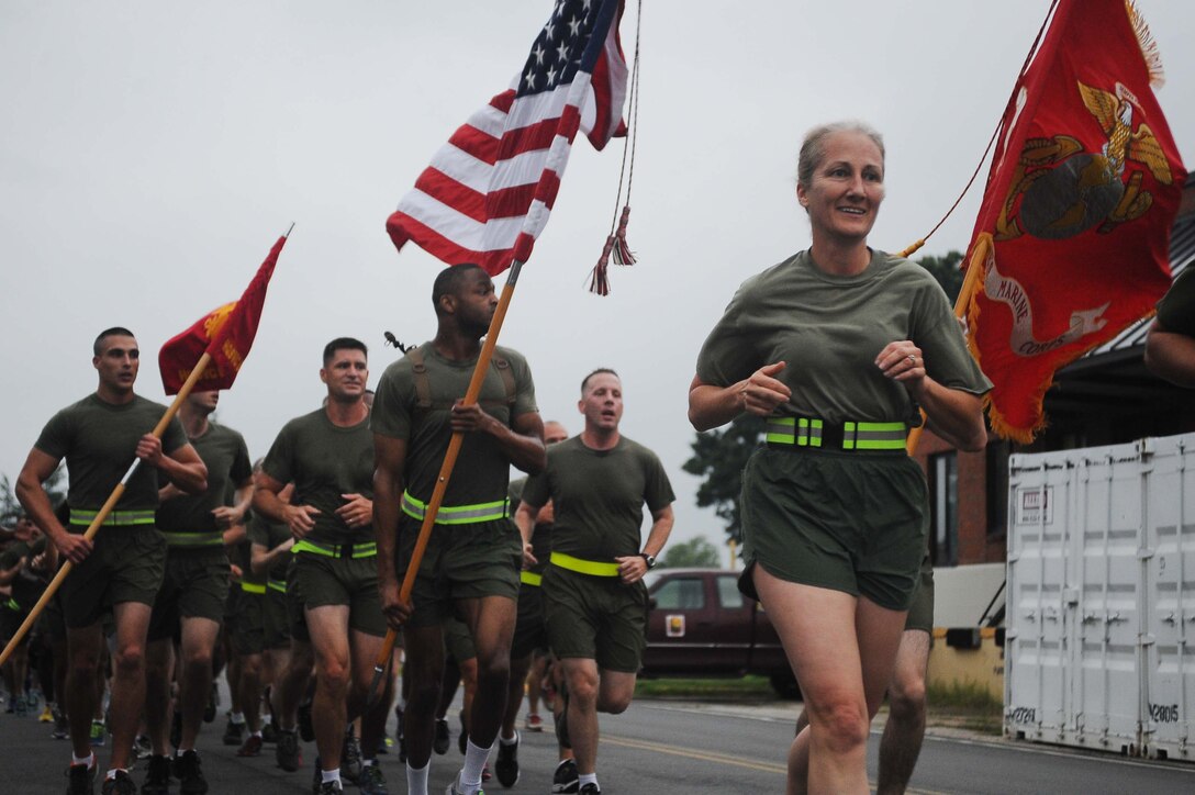Col. Robin Gallant, the commanding officer of Headquarters and Service Battalion, led Marines in a battalion run aboard Marine Corps Base Quantico on Aug. 29, 2013. Gallant has been serving as the H&S Bn. commanding officer for 7 months. 
