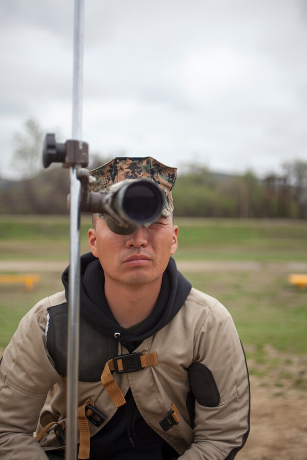U.S. Marine Corps Sgt. Aaron Stringer, recruiter with RSS Fairfield, RS San Francisco, 12th Marine Corps District, looks through a scope at Wilcox Range aboard Camp Pendleton, Calif., March 4, 2014. Stringer was competing in the 2014 Western Division Matches. (U.S. Marine Corps photo by Cpl. Catie Massey, 12th Marine Corps District Headquarters/Released)